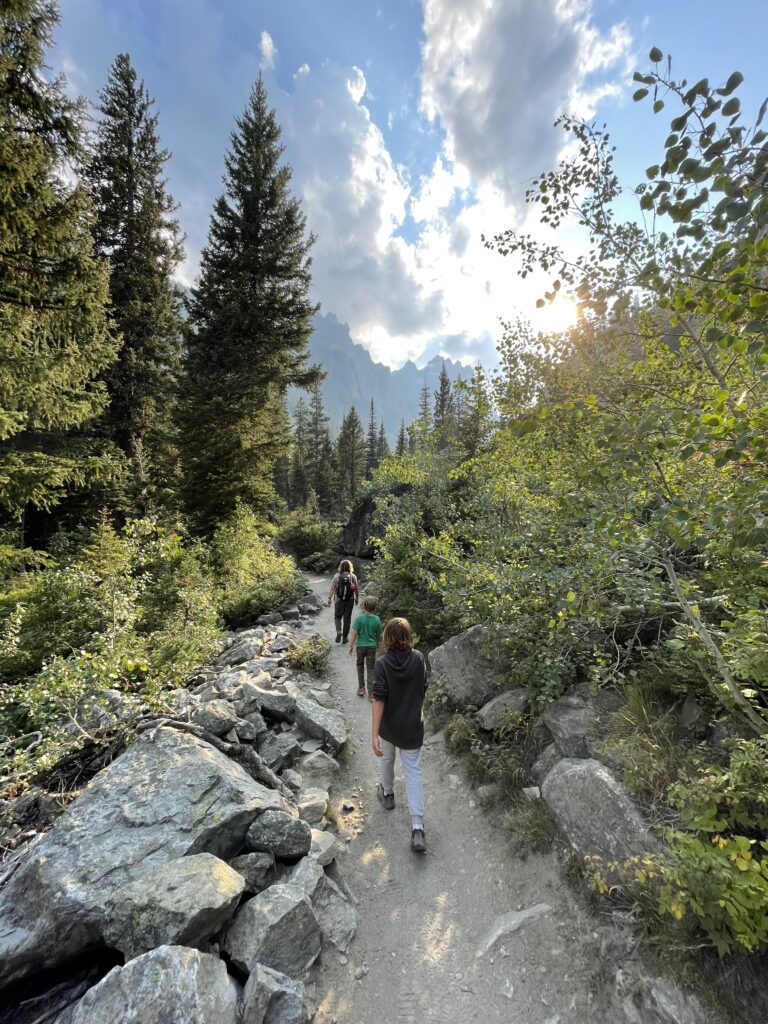 Family walking down a trail