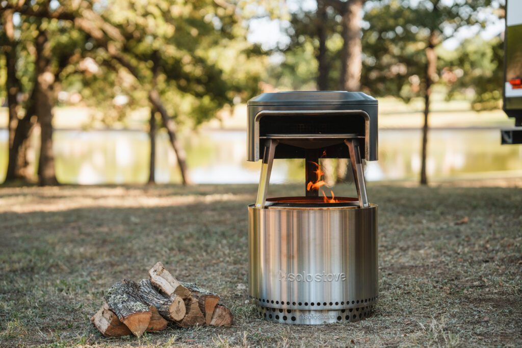 Solo stove at a campground with pizza oven attachment