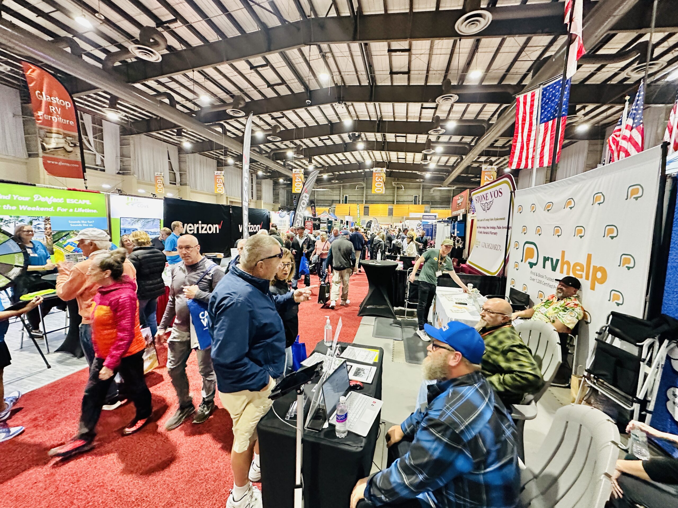 People shop at vendor booths at the Florida RV Supershow in Tampa Florida